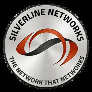 Silverline Networks circular logo with red and black swoosh design and text reading The Network That Networks